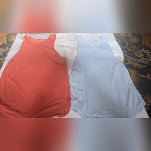 Two Lululemon Sleeveless Tops. Robin Egg Blue And Light Orange.